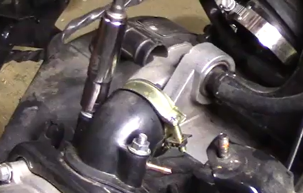 Tightening Genuine Buddy 125 intake manifold M6 flange nuts using 1/4-inch drive torque wrench set to 10 Nm