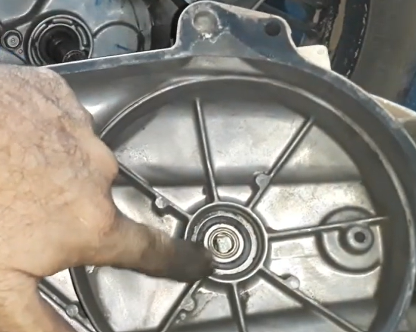 Inspecting Honda PCX 150 CVT crankcase cover outer crankshaft support bearing and oil seal