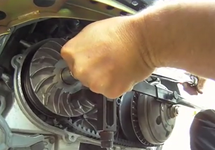 Torquing Suzuki Burgman 400 front variator nut using holder tool and torque wrench to 105 Nm