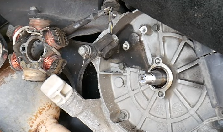 Old GY6 stator assembly removed from the crankcase side