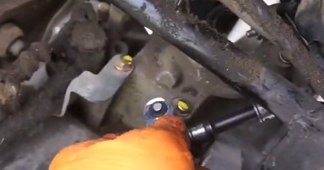 Checking GY6 carburetor vacuum diaphragm for tears by stretching edges under bright light